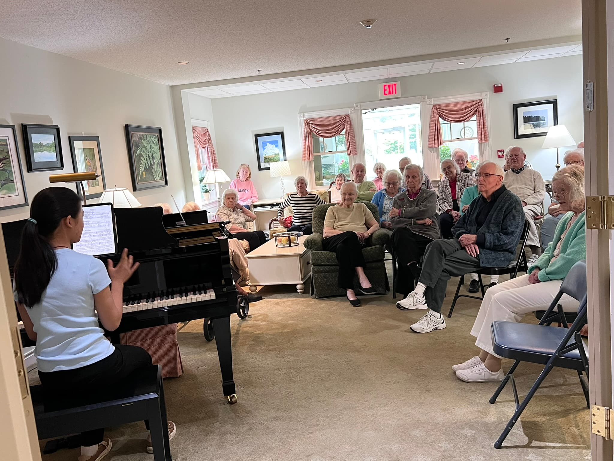 A pianist performs for senior community residents