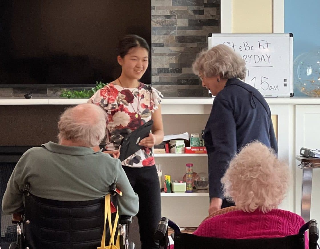 Young musicians perform together in a senior living community