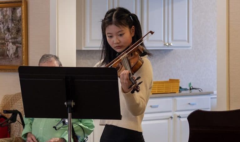 An audience listens closely during a live concert