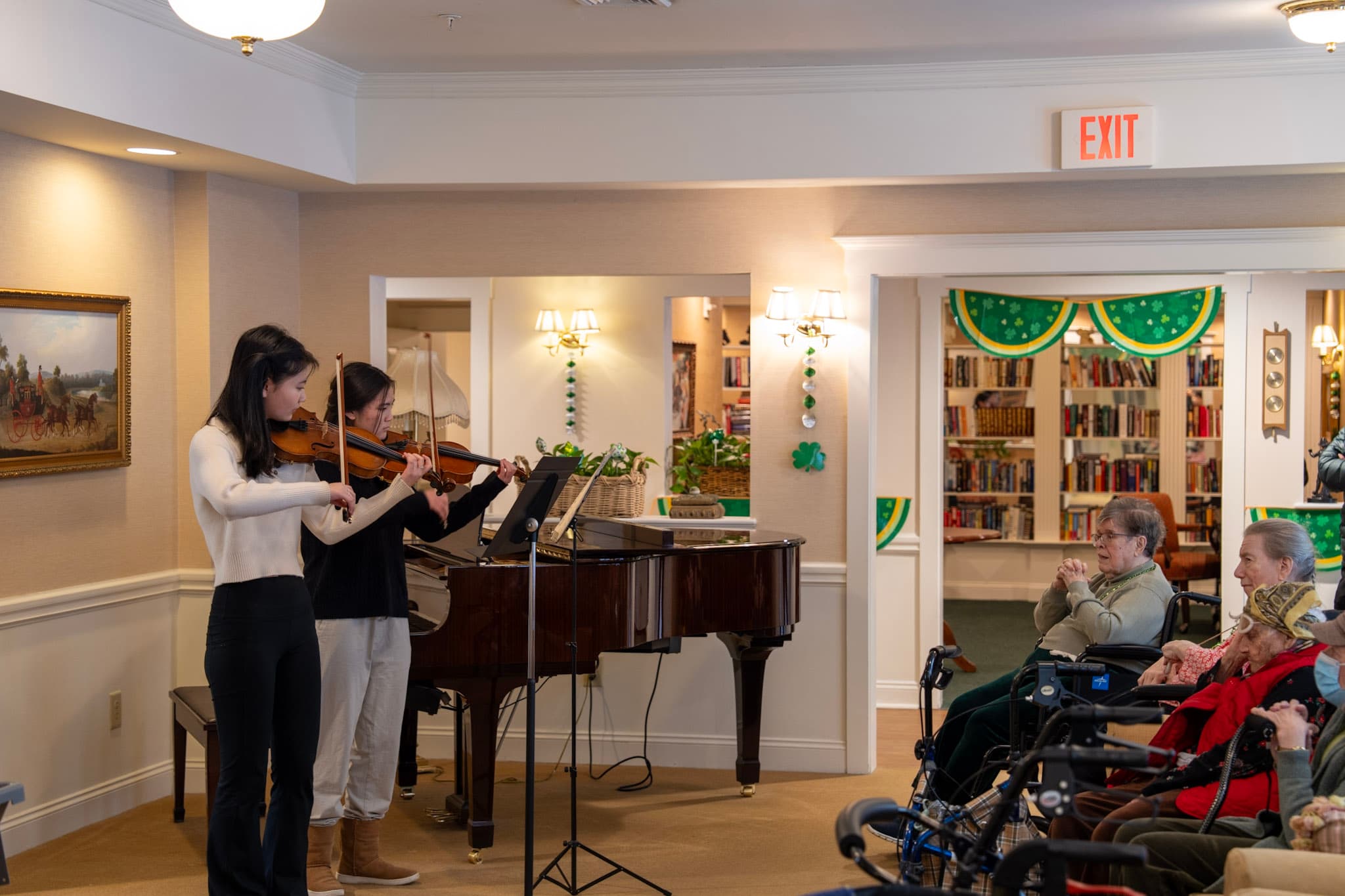 Two Harmonic Tie musicians perform for residents