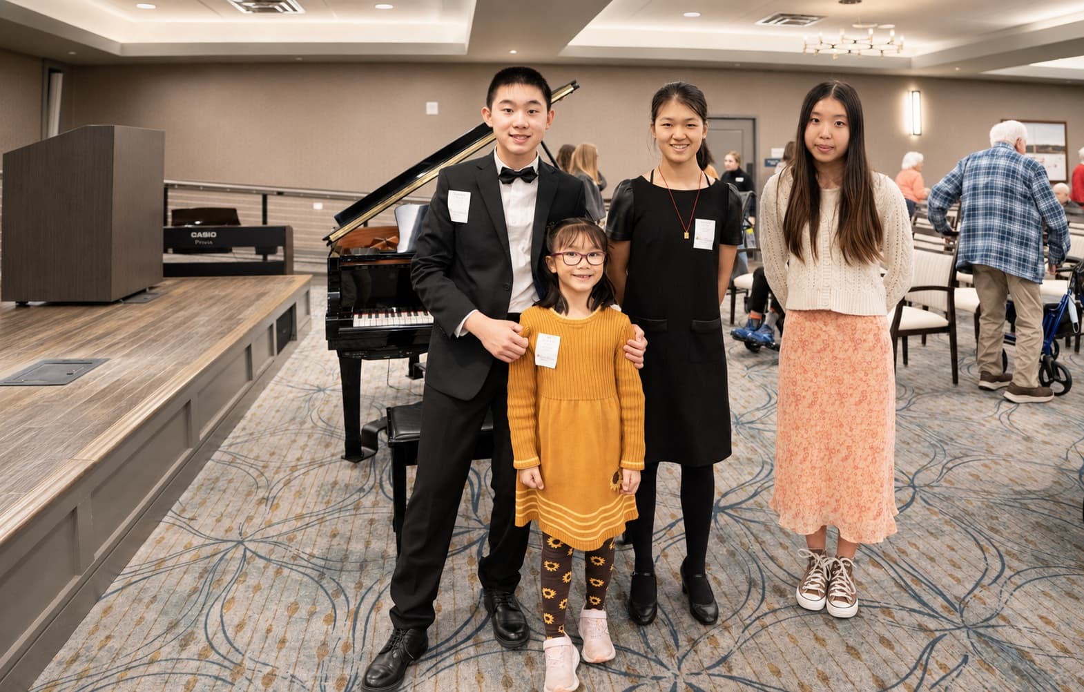 A young musician performs for residents in a senior community