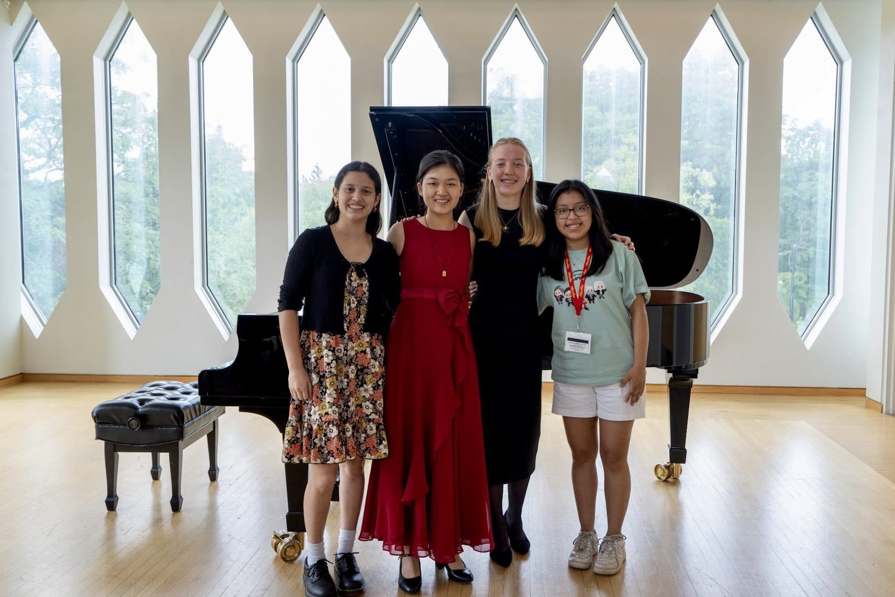 Harmonic Tie musicians gather around a grand piano